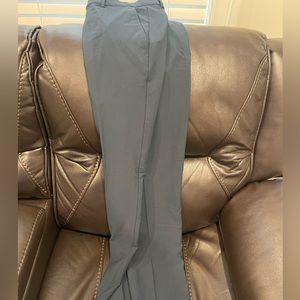 Men’s Greg Norman pants. Never work w/tags. 34/32